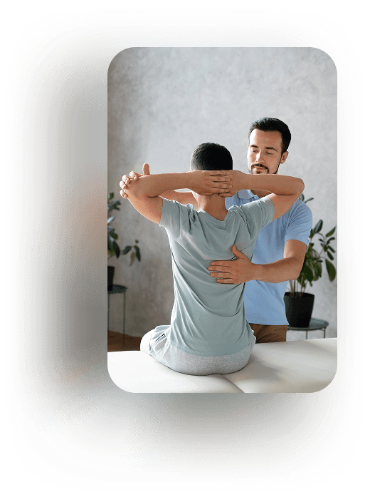 Physiotherapist treating a patient's back.